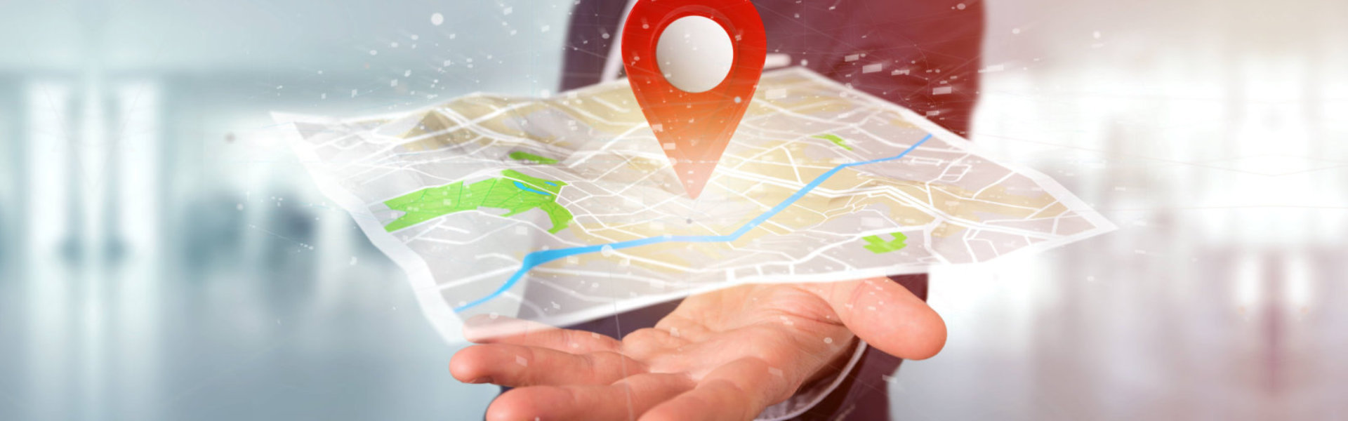 a hand showing a digital map